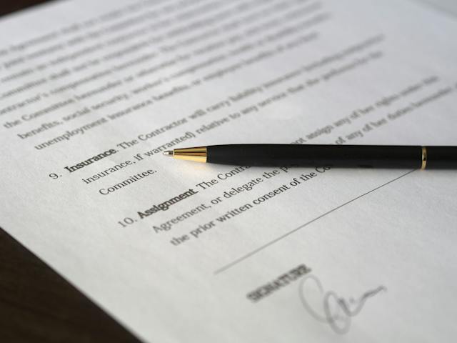 Document with a pen on top of it